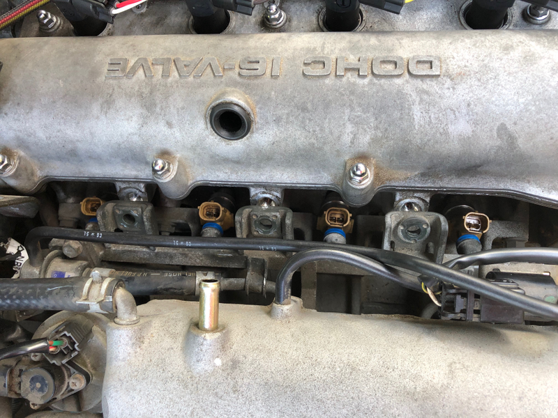 New injectors in and loosely seated. Needs to be seated and bolted back in.